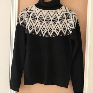 Beautiful black turtleneck with snowy white pattern. Perfect for winter.